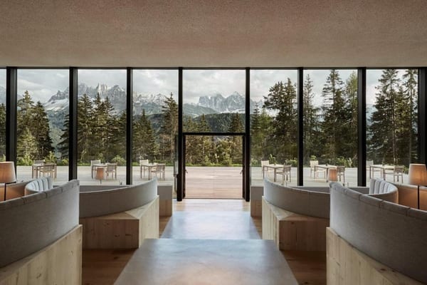 Forestis Dolomites hotel exterior and forest setting